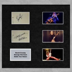 Framed autographs and photos of musicians.