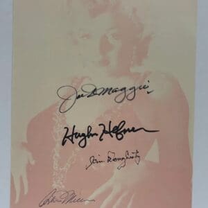 Autographed photo of a woman with signatures.