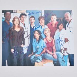 Group of people in medical attire, signed.