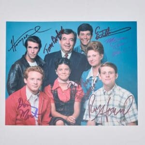 Group portrait of people with autographs.