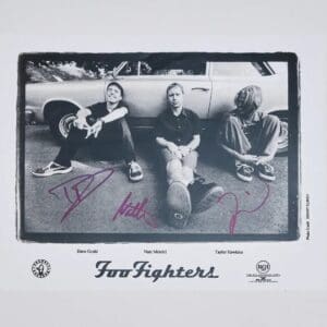 Black and white band photo, autographed.