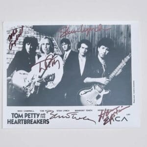 Black and white band photo with signatures.