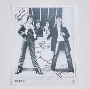 Black and white signed photo of band.