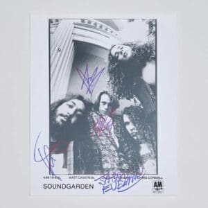 Black and white band photo with signatures.