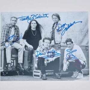 Five men posing, autographed black-and-white photo.