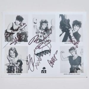 Black-and-white signed band member portraits.