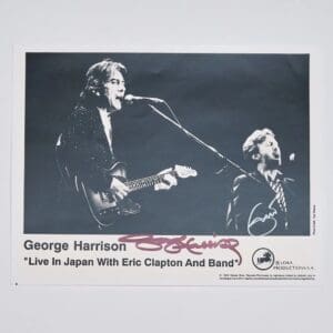 George Harrison performing live with Eric Clapton.