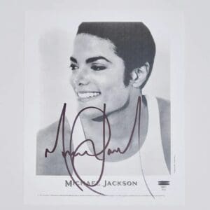 Black and white portrait with autograph.