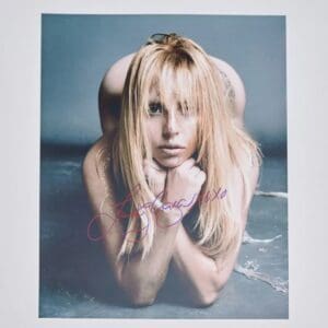 Person with blonde hair lying on floor.