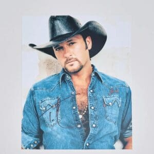 Man in cowboy hat and denim shirt.