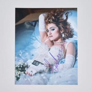 Woman in lace dress lying on bed.