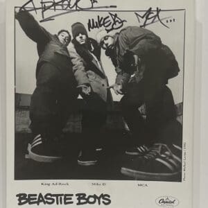 Three men posing in a black-and-white photo.