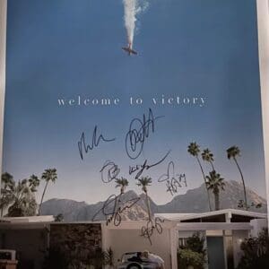 Movie poster with autographs and palm trees.
