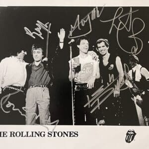 Black-and-white band photo with signatures.