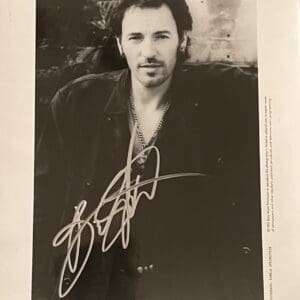 Man in black jacket, signed photograph.