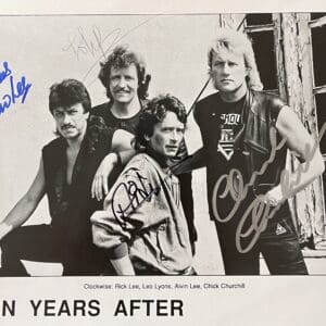 Rock band group photo with autographs.