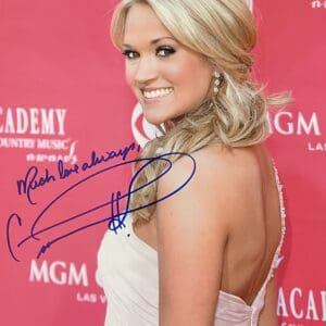Smiling woman in elegant dress, red carpet.