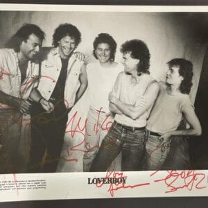 Five people posing in a black-and-white photo.