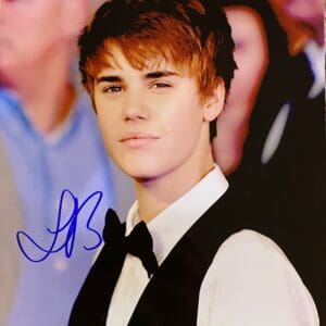 Young man in formal attire, signed photo.