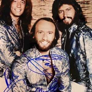 Three men in shiny blue jackets.