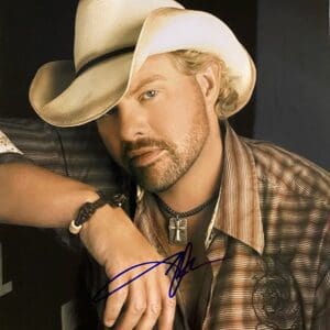 Man in cowboy hat and plaid shirt.