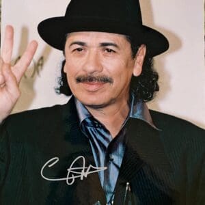 Man in hat making peace sign gesture.