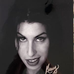 Woman with dark hair and piercing gaze.
