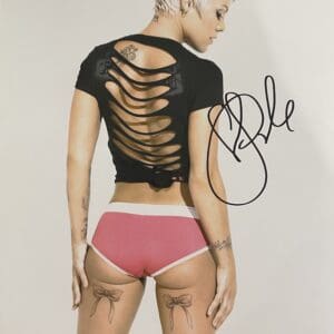 Person with short hair, back cutout shirt.