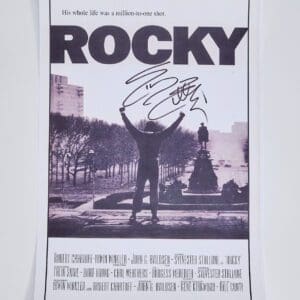 Signed Rocky movie poster with iconic scene.