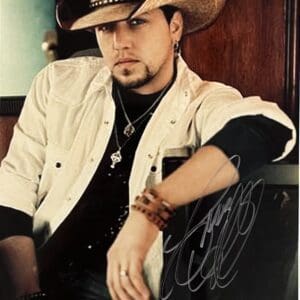 Man in cowboy hat and white shirt.