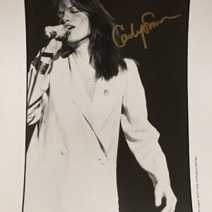 Singer performing passionately in monochrome image.
