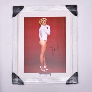 Framed signed photo of woman in bodysuit.