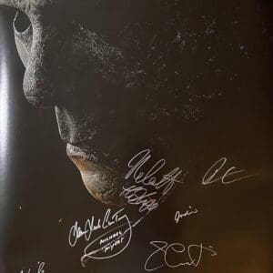 Horror movie poster with multiple signatures.