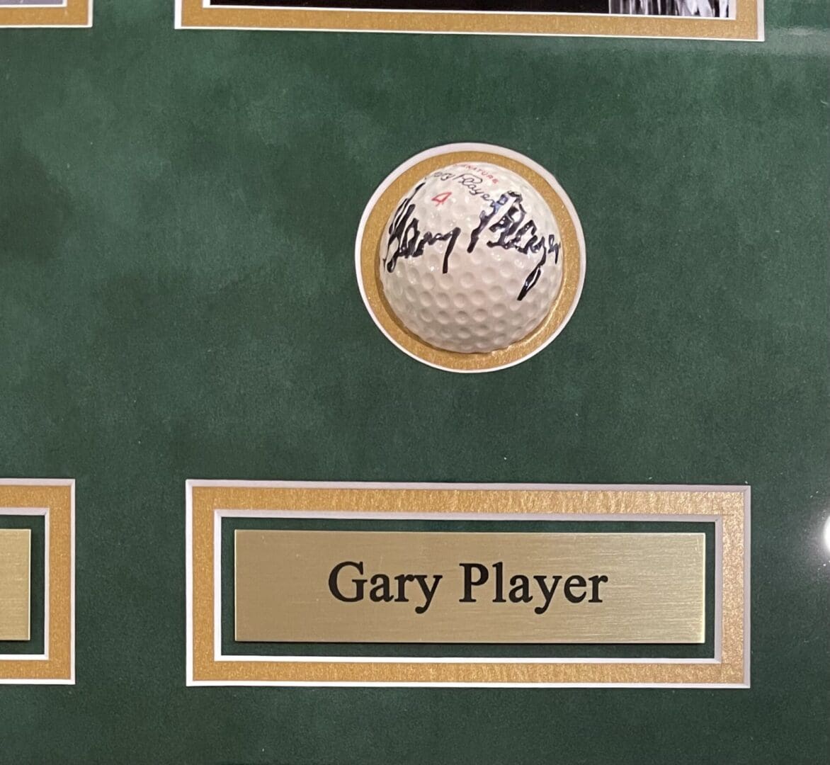 Signed golf ball with Gary Player label.