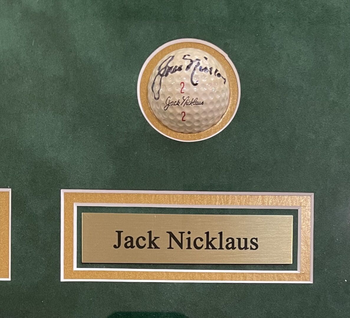Signed golf ball with Jack Nicklaus plaque.
