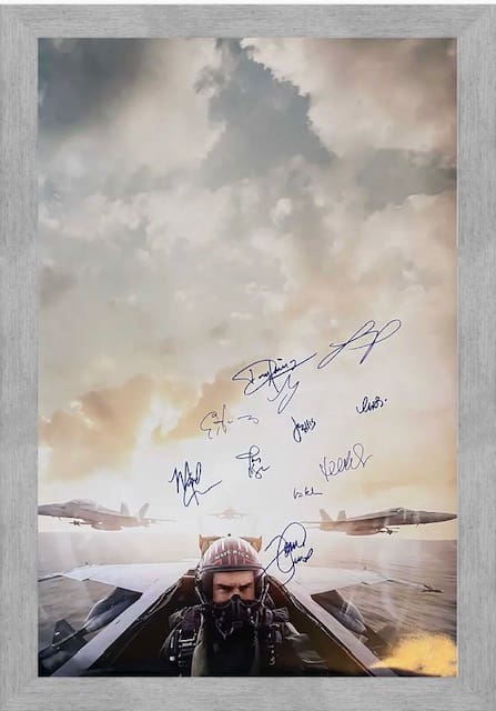 Pilot in jet with autographed sky background.