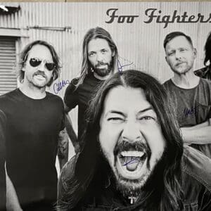 Band posing in black and white photo.