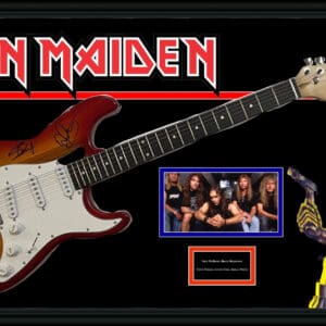 Iron Maiden guitar with band photo and mascot.