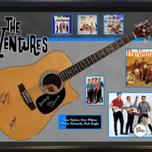 Framed guitar and The Ventures memorabilia display.