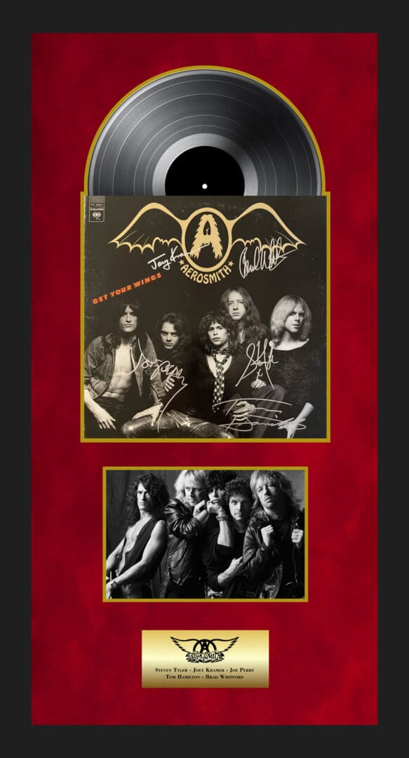 Framed Aerosmith album with band photo.
