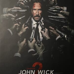 Movie poster: John Wick surrounded by guns.