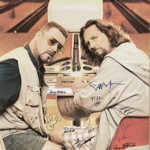 Two men seated in a bowling alley.