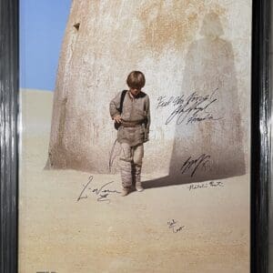 Child standing in desert with shadow.