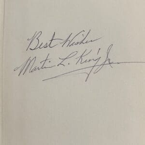 Handwritten note with a signature.