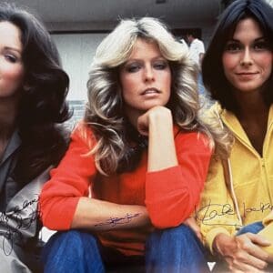 Three women seated with serious expressions.