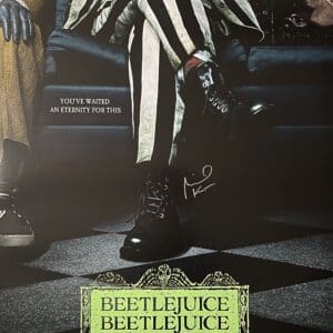 Beetlejuice movie poster with striped suit.