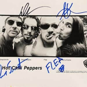 Black and white band photo with signatures.