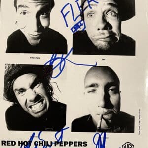 Black-and-white band photo with signatures.