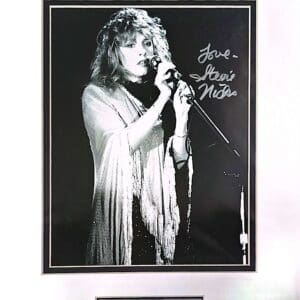 Singer performing with microphone, black and white.