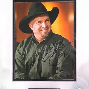 Man in cowboy hat, signed photo portrait.